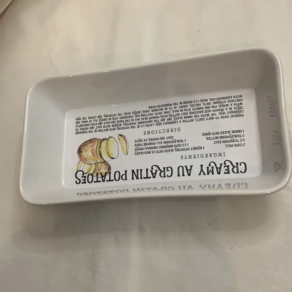 Creamy Au Gratin Potatoes Recipe Baking Dish Oblong White Ceramic Black Letters
